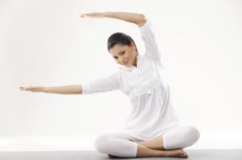 Portrait of woman in casual clothes practicing yoga 
