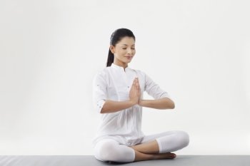 Woman with hands joint meditating 