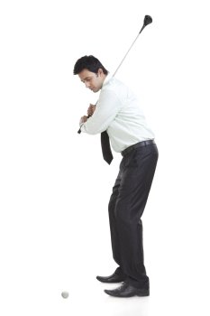 Business executive playing golf