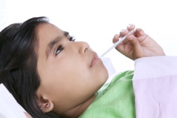 Little girl with thermometer in mouth