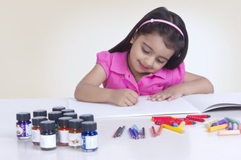 Cute girl coloring against white background