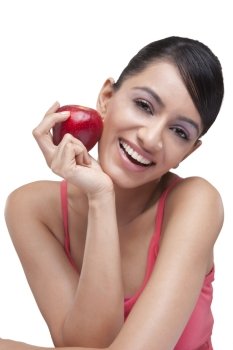 Portrait of cheerful young woman with fresh apple 