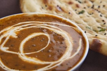 Close-up of dal makhni with naan