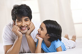 Portrait of father and son smiling
