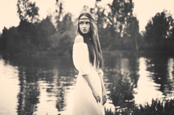 Black and white outdoors fashion  photo of beautiful bohemian lady at river