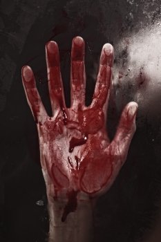 	Human hand with blood. Halloween theme.