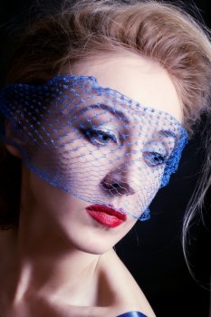 Portrait of a young beautiful blue-eyed women in veils closeac