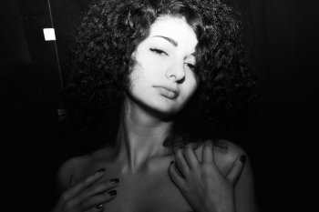 Black and white portrait of passionate curly girl closeup