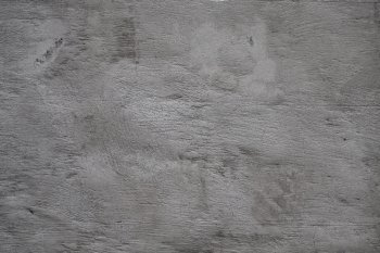 Texture of the gray concrete wall close-up
