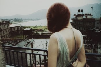 Young beautiful woman on the roof