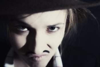 Face of young woman with mustache closeup