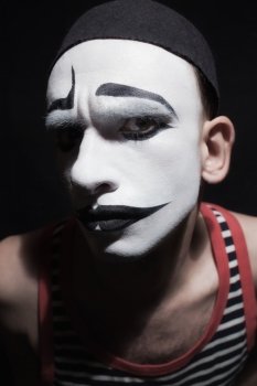 Face of mime fctor on black background