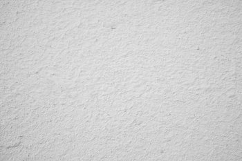 Texture of white painted concrete wall closeup