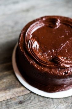 Chocolate cake on wooden background