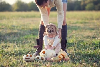 Mother showing baby pumpkin