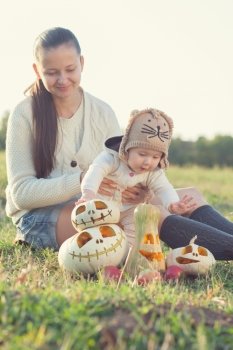 Mother showing baby pumpkin