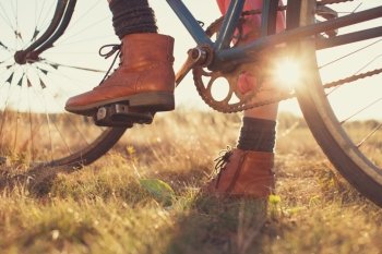 Female boots and vintage bike