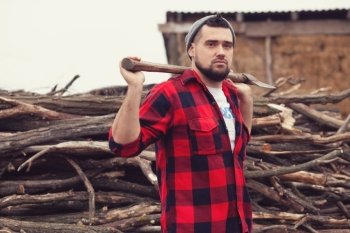Stylish young man posing like lumberjack