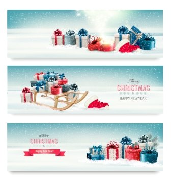 Three Christmas banners with presents and a sleigh. Vector.