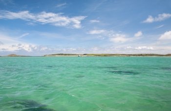 The beautiful emerald sea  in summer at the Isles of Scilly, Cornwall, England.