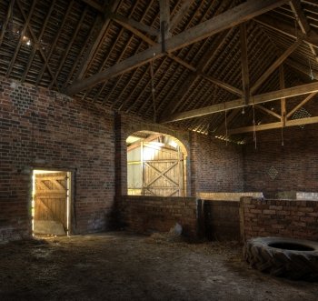 Old brick and timber constructed hay barn, Worcestershire, England.