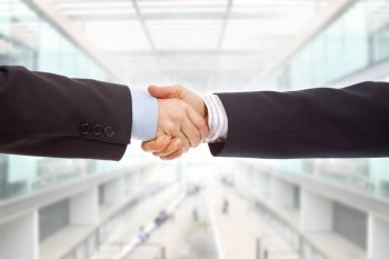 Business couple hand shake at the office