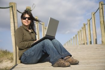 young happy woman working with her laptop