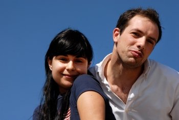 young couple portrait with the sky as background
