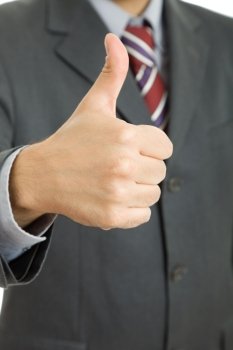 Businessman going thumbs up, close up picture