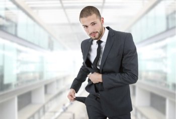 businessman showing his empty pocket, at the office