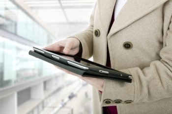 Woman holding a digital tablet at the office