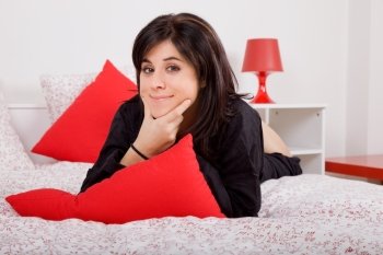 young beautiful sensual woman in bed, studio picture