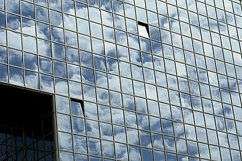 modern office building and the clouds reflection