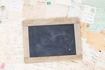 Old mail with blank blackboard. Old mail and  blank blackboard with copy space