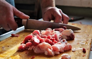 Classical cuisine, cutting meat with a knife
