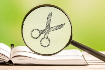 Hairdresser search with a pencil drawing of a scissor in a magnifying glass