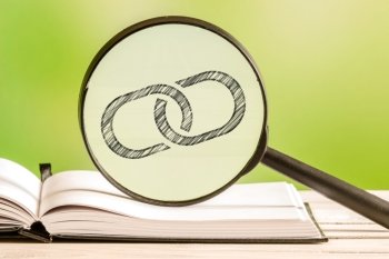 Link information with a pencil drawing of a chain link in a magnifying glass