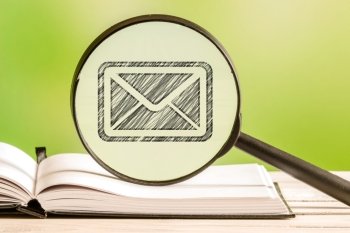 Mail search with a pencil drawing of a letter in a magnifying glass