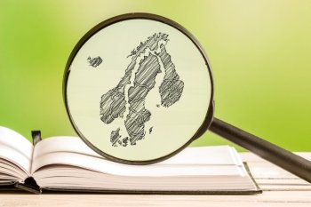 Scandinavia information with a pencil drawing of a scandinavian map in a magnifying glass