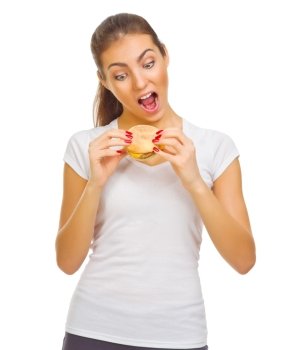 Young smiling girl eat hamburger isolated