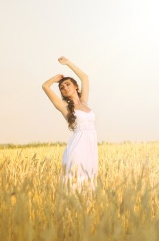 Young woman on wheat field
