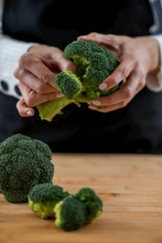 Fresh organic broccoli, a superfood rich in vitamin K, vitamin C, folic acid, potassium, phytonutrients, and fibers.