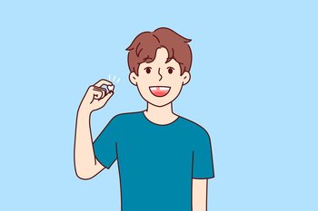 Happy kid demonstrates lost baby tooth and smiles, rejoicing at beginning of growing up. Positive pre-teen boy is waiting for tooth fairy to give him gift, for advertising dentist clinic.. Happy kid demonstrates lost baby tooth and smiles, rejoicing at beginning of growing up