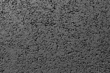 New black asphalt road surface close up abstract texture background.