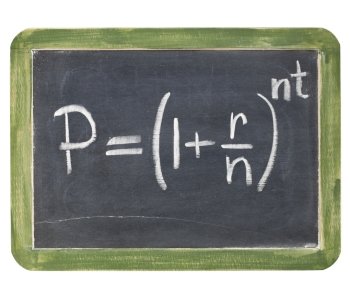 compound interest equation - white chalk handwriting on a small slate blackboard, isolated with clipping path