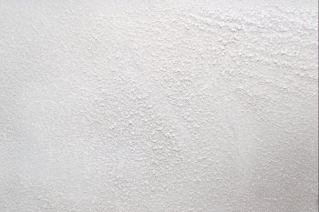 White wall with a powdery substance. Can be used as a background for your projects