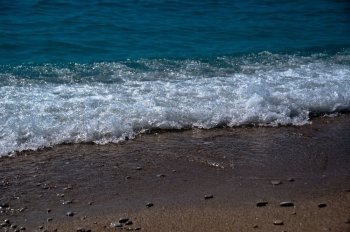 Waves hitting the beach at Oludeniz, near Fethiye, Turkey 
