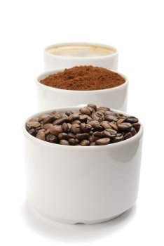 cups with coffee beans, blend and espresso. closeup