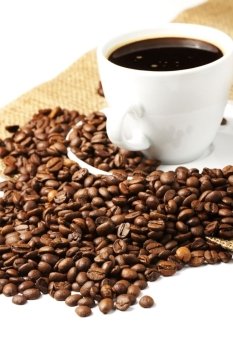 coffee in a coffee cup and jute. coffeebeans near coffee cup and jute on white background