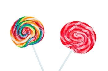 Swirled and colorful candy lollipops on white background.